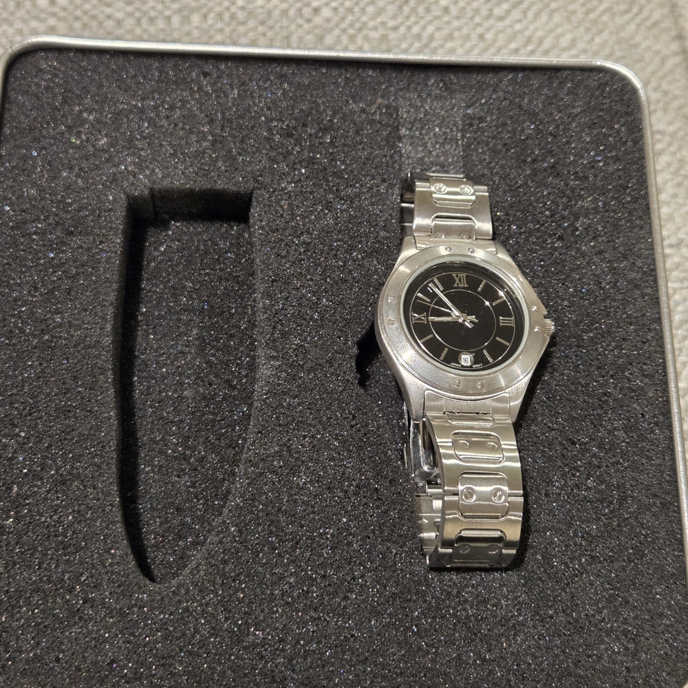 Silver In Color Watch with Black Dial Needs A Battey